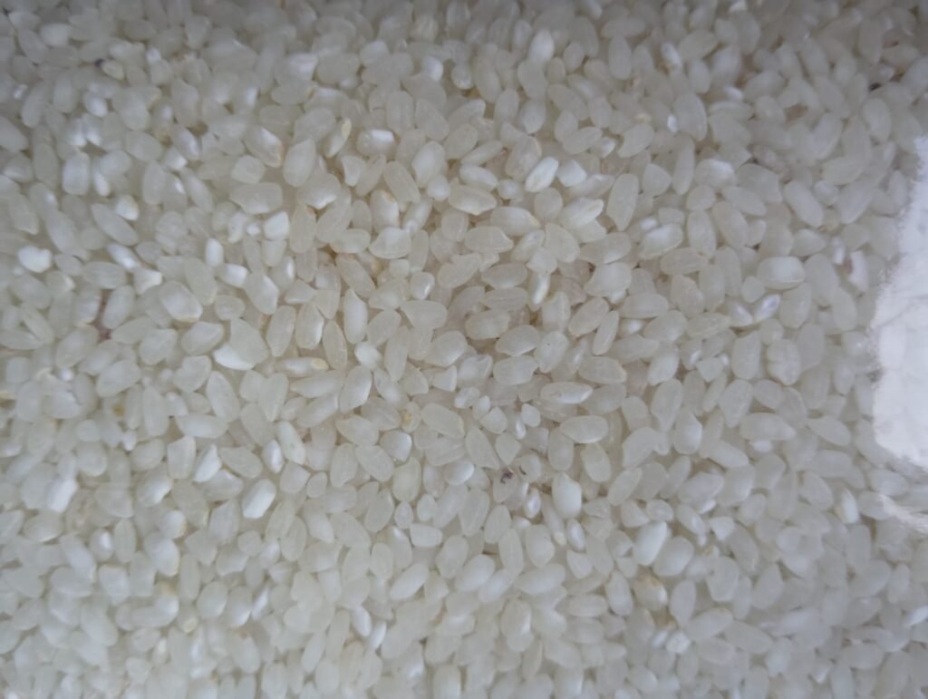 Close view of uncooked white rice grains
